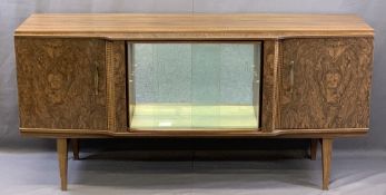 MID-CENTURY BEAUTILITY WALNUT EFFECT SIDEBOARD of central mirrored cabinet with sliding glass