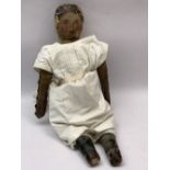 PRIMITIVE AMERICAN FOLK ART DOLL, stitched cloth body and leather limbs with painted hair and facial