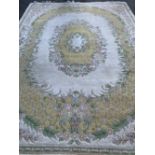 OLD ENGLISH STYLE EASTERN WOOLLEN CARPET, cream ground with yellow and floral oval cameo and