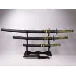 SET OF JAPANESE DISPLAY SWORDS ON STAND and a US Aqualung diver's knife with holster