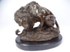 AFTER ANTOINE-LOUIS BARYE REPRODUCTION BRONZE FIGURE of a lion attacking a snake on an oval black