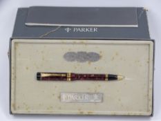 PARKER DUOFOLD CENTENNIAL BALLPOINT PEN, early cap activated model in marbled burgundy with original