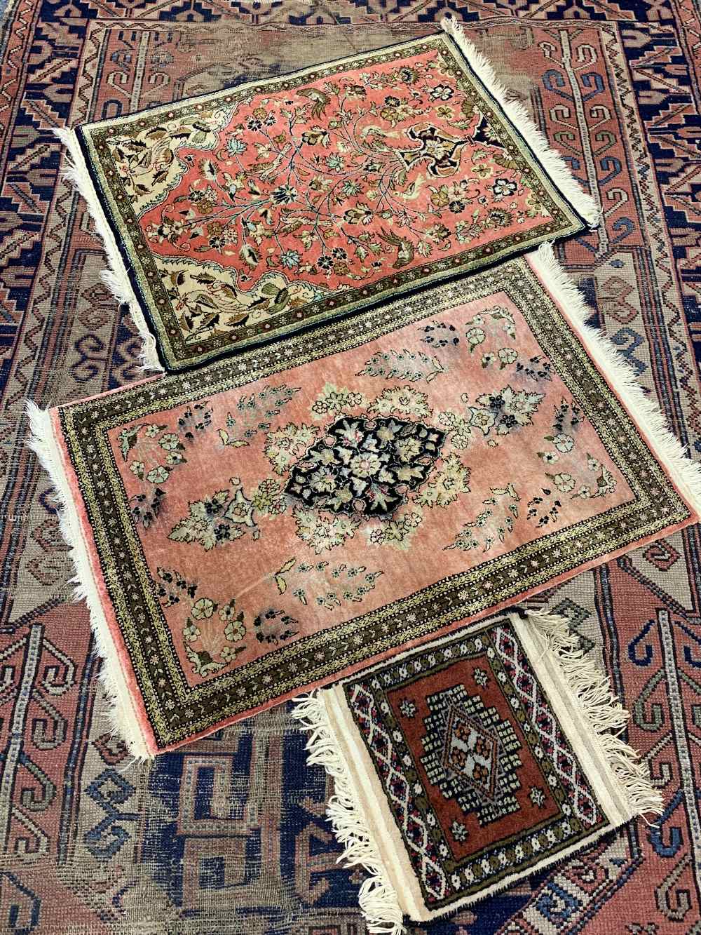 ANTIQUE & LATER EASTERN RUGS including a 210 x 144cms blue and red ground example, traditionally