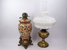 VICTORIAN OIL LAMPS (2) including a Persian type decorated pottery and cast metal example in a