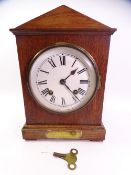 OAK PENDULUM MANTEL CLOCK with eight day movement and backplate marked 'W & H SCH'