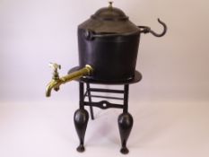 CAST IRON TWO GALLON TEA URN marked 'A Kenrick & Sons' on a four footed stand