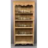 RUSTIC PINE BOOKCASE with carved and scrolled detail, 182 x 85 x 28cms and a set of similar style