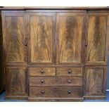 TRIPLE WARDROBE WITH BREAKFRONT, late Victorian mahogany, labelled 'M Wilson, Great Queen St',