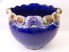 MAJOLICA STYLE JARDINERE ON STAND in Cobalt Blue with stylised flowers in relief, 93cms overall H,