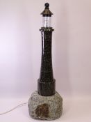 A CORNISH LIGHTHOUSE SHAPED TABLE LAMP, 60cms tall (replaced glass)