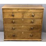 19th CENTURY OAK CHEST of two over three long drawers and secret upper drawer with turned knobs, 102