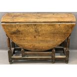 LATE 18TH/EARLY 19TH CENTURY DROP LEAF OAK TABLE on turned and block supports, 72cms H, 39cms W,