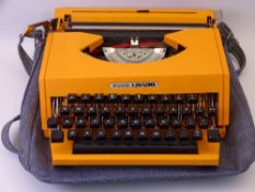 RETRO TYPEWRITER - an orange plastic Esselte Lisa 30 portable typewriter in a canvas case