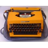 RETRO TYPEWRITER - an orange plastic Esselte Lisa 30 portable typewriter in a canvas case