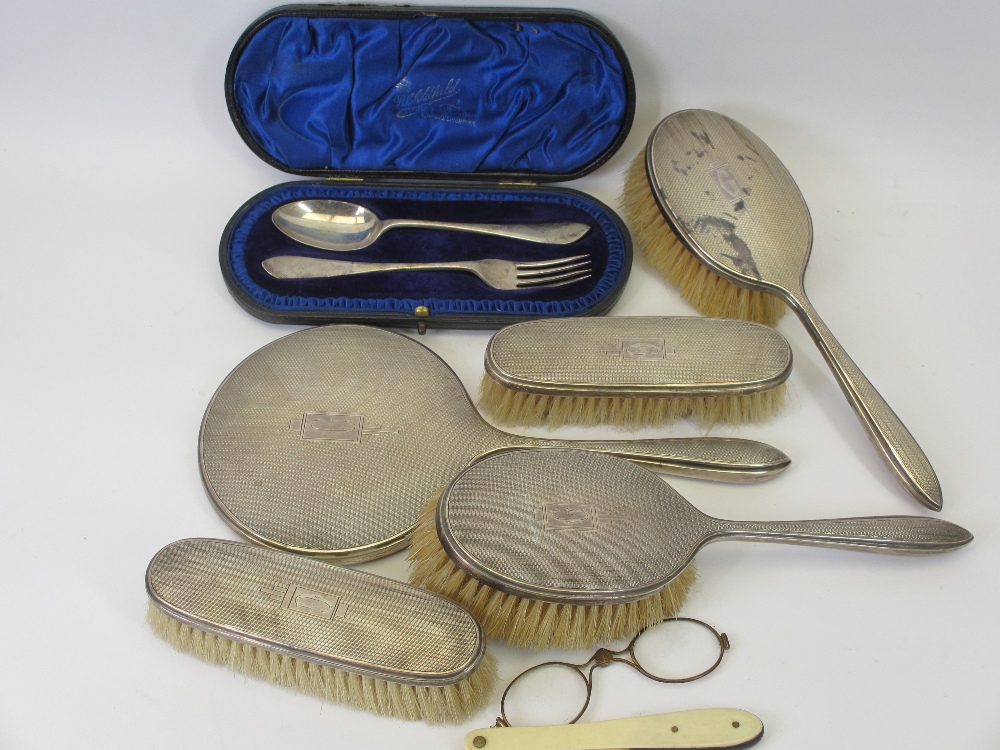 SILVER DRESSING TABLE SET, five pieces to include four brushes and a mirror, Sheffield 1946/7, a