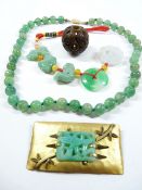 A STRING OF JADE BEADS, Jade mounted brooch, Jade necklace and a carved hardstone ball