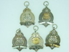 SILVER TROPHY PENDANTS (5) - three marked 'Manchester Association' and two marked 'Empire