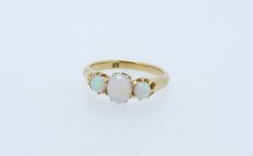 18CT GOLD THREE STONE OPAL SET RING, size K, 3.3grms