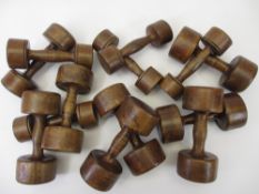 EARLY 20TH CENTURY WOODEN EXERCISE DUMBELLS - a collection of 13, all different weights