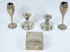 SILVER CIGARETTE BOX, pair of squat candlesticks and two bud vases, Birmingham hallmarks dated 1898,