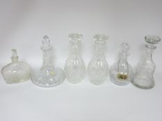 GLASS DECANTERS - a pair with stoppers, ship's decanter and three others