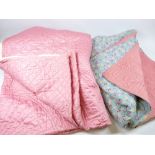 TWO PINK SILK EFFECT THROWS - 1. Blue ground with small floral squares and pink back, approx 210 x