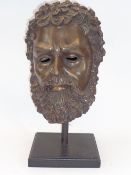 REPRODUCTION BRONZE ANTIQUITIES STYLE HEAD - a bearded man mounted on a wooden base, 46cms H