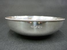 A SILVER BOWL - circular plain with shallow pedestal and with a narrow studded rim, Sheffield