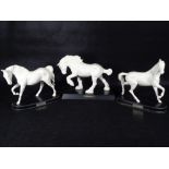 BESWICK POTTERY HORSES (3) - in matt white on titled wooden bases to include 'Spirit of The