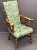 UNUSUAL SMOKER'S BOW TYPE ARMCHAIR - high upholstered back and seat, curled arm ends on spindle