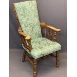 UNUSUAL SMOKER'S BOW TYPE ARMCHAIR - high upholstered back and seat, curled arm ends on spindle