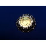 GEORGE IV BARE HEAD GOLD SOVEREIGN - in 9ct gold brooch mount, crowned shield, indistinctly dated,