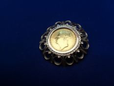 GEORGE IV BARE HEAD GOLD SOVEREIGN - in 9ct gold brooch mount, crowned shield, indistinctly dated,