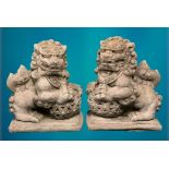 GARDEN STONEWARE - reconstituted statuary Chinese Temple lions, a pair holding an open carved ball