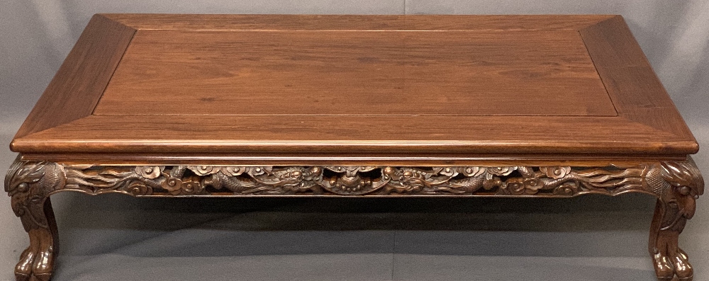 20TH CENTURY CHINESE HARDWOOD OVERSIZE COFFEE TABLE - lower carved frieze detail and mask corners on