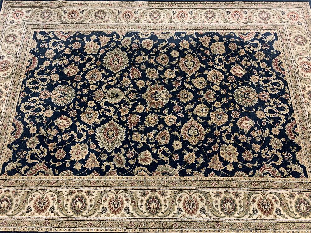 EASTERN STYLE BLUE GROUND CARPETS (2) - a repeating colourful floral pattern with bordered edge - Image 3 of 4