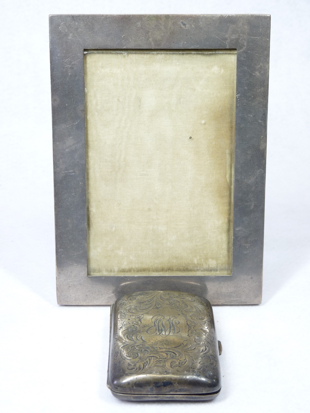 CHESTER SILVER PHOTOGRAPH FRAME and a sterling stamped cigarette case, the frame date stamp