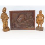 RUSTIC DEEP CARVED GUN DOG WITH GAME PANEL and two standing figurines of a young boy with