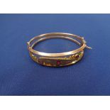 CHESTER 1908 9CT GOLD LADY'S BANGLE - open double frame style with ball and bar decorated top set