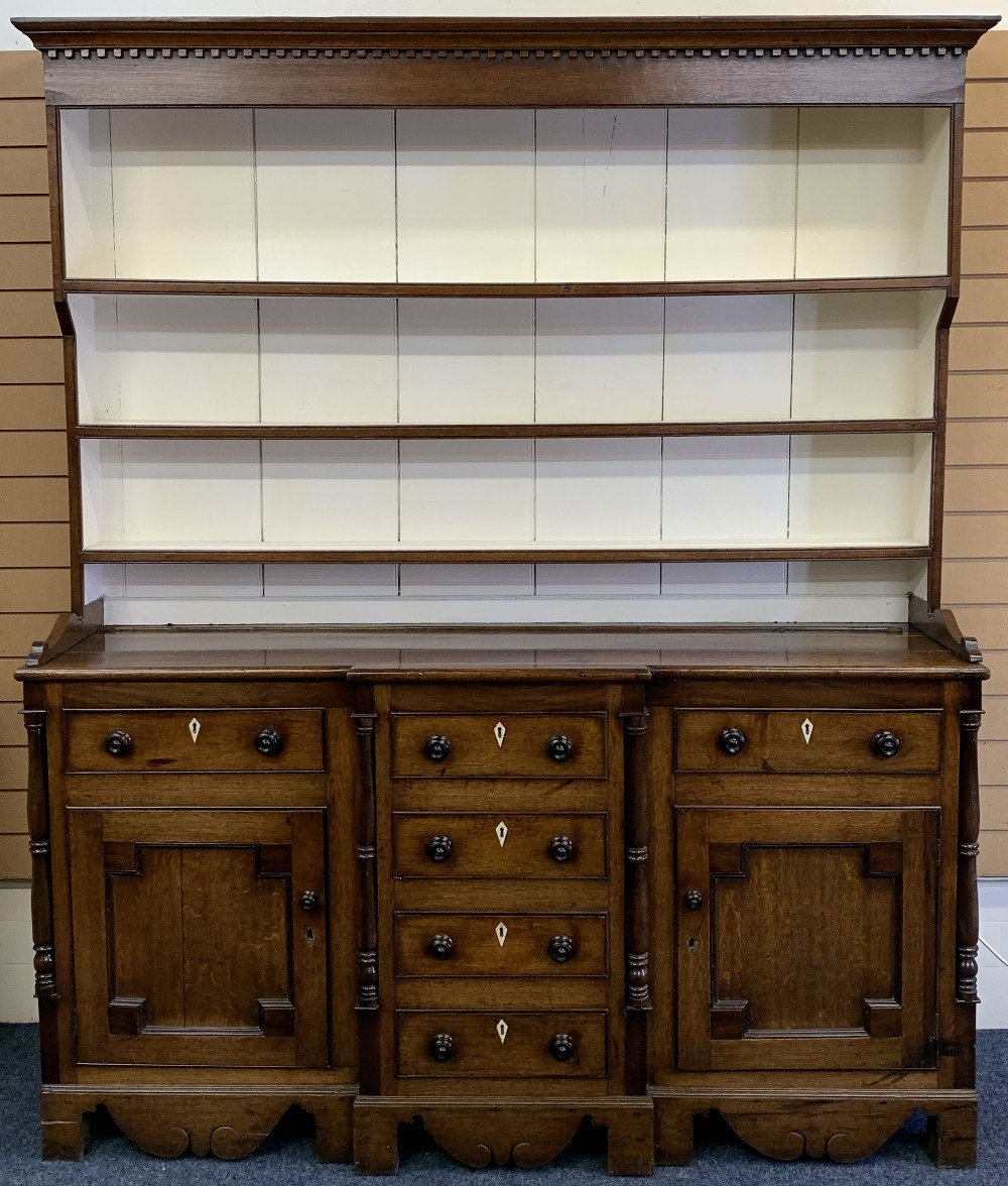 NORTH WALES OAK BREAKFRONT DRESSER - 19th century, painted interior deep shelf rack, the base with a