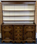 NORTH WALES OAK BREAKFRONT DRESSER - 19th century, painted interior deep shelf rack, the base with a