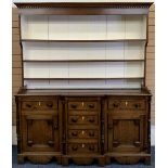 NORTH WALES OAK BREAKFRONT DRESSER - 19th century, painted interior deep shelf rack, the base with a