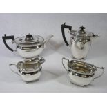A FOUR PIECE SILVER TEA & COFFEE SERVICE - each piece of oval plain form with four ball supports and