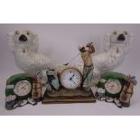 WHITE STAFFORDSHIRE COMFORTER DOGS, A PAIR and three golfing interest composition clocks