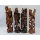 CHINESE & OTHER WOOD CARVINGS (4) - depicting two elderly pipe smoking men, a bearded figure with
