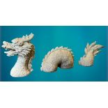 GARDEN STONEWARE - reconstituted statuary of a writhing dragon in three sections, 45cms H the head