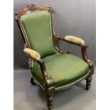 EDWARDIAN MAHOGANY GENTLEMAN'S UPHOLSTERED ELBOW CHAIR - on turned feet with carved detail, 96cms H,