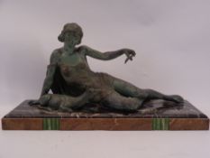 FRENCH ART DECO SPELTER & MARBLE FIGURINE depicting a scantily clad reclining female and a recumbent