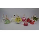 ROYAL DOULTON LADY FIGURINES (8) and one Royal Worcester titled 'First Dance 3629', the Doulton's
