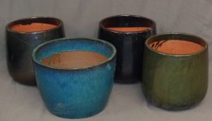 GARDEN STONEWARE - a trio of glazed pots, 35cms tall and 33cms diameter at top, and another